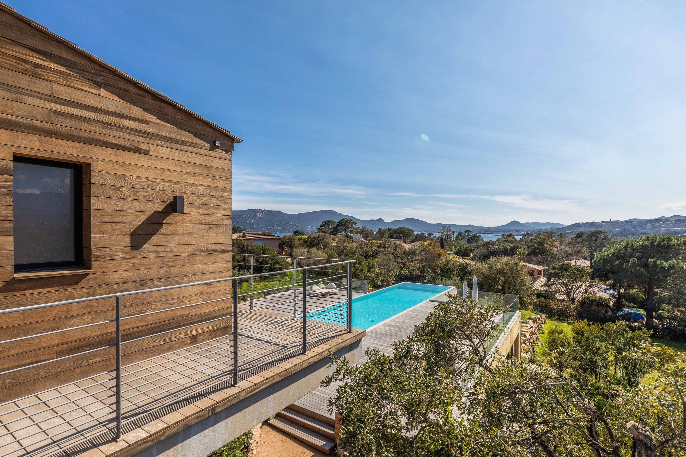 Cedar-clad façade and the pool