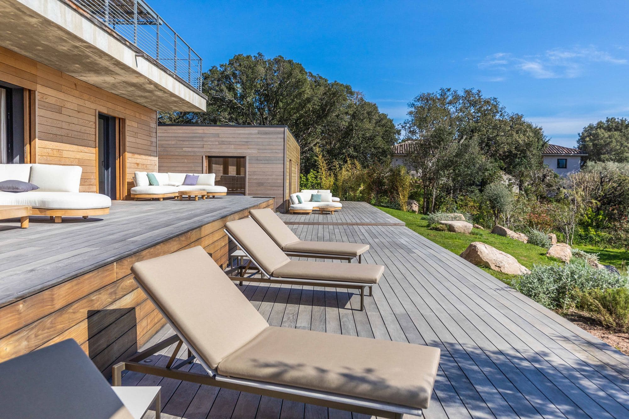 Terrace, loungers and the granite formations of the grounds
