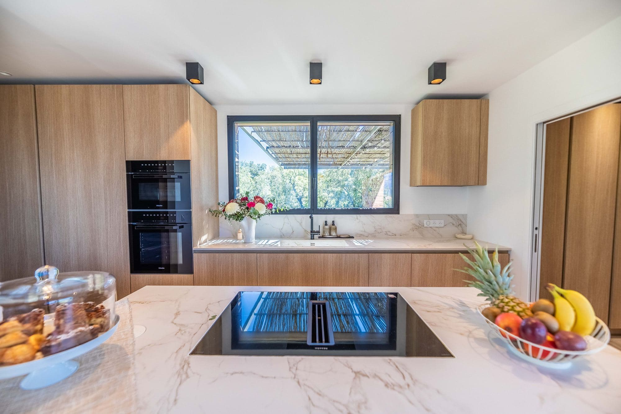 Miele-equipped kitchen with central island