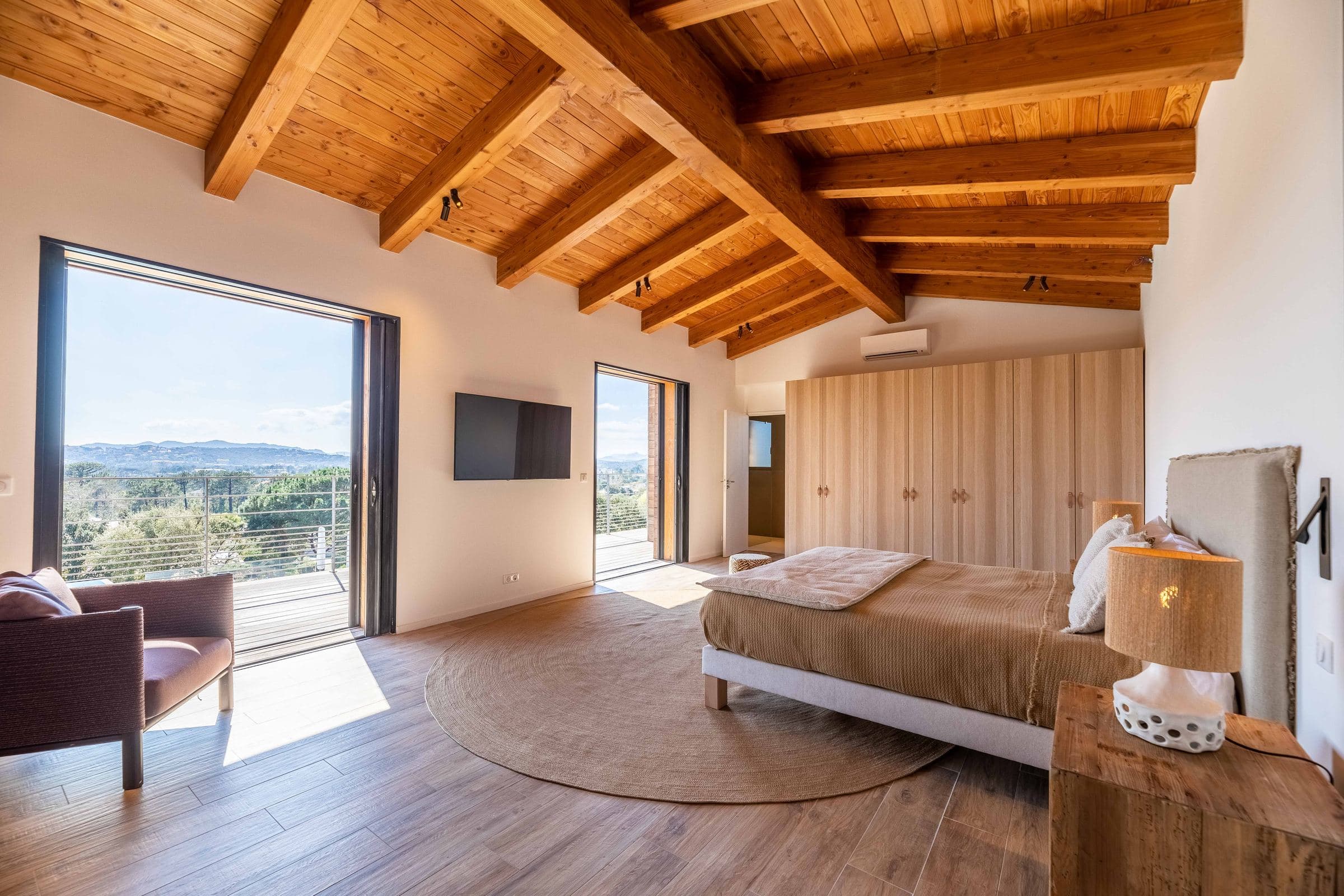 Primary suite under the timber ceiling